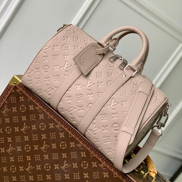 KEEPALL BANDOULIÈRE 34 BAG IN LIGHT BROWN MONOGRAM TAURILLON CALFSKIN
